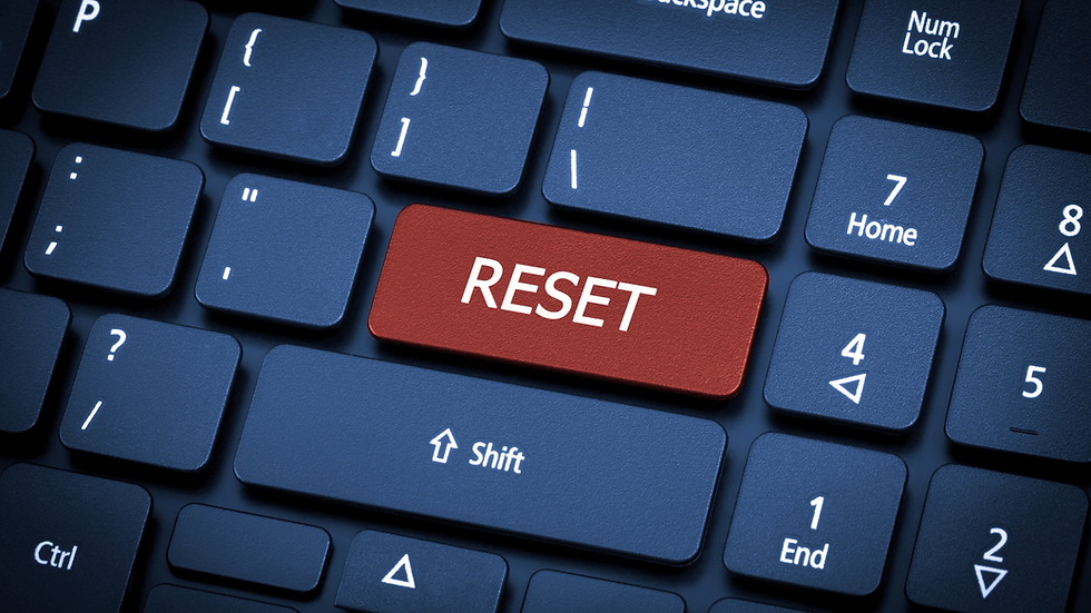 A keyboard with a red reset button