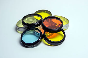 Different colored optic lenses that are cleaned of dust