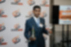 Entrepreneur presenting during Power to Pitch entrepreneurship competition at Stimulating Success Foundation event
