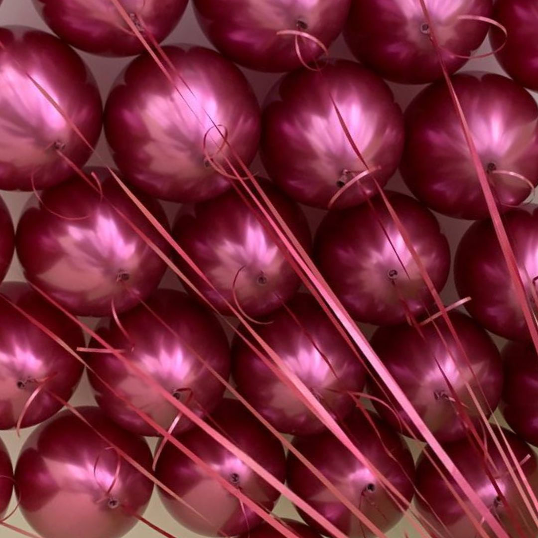 Chrome fuchsia ceiling balloons delivered from rhe local balloons shop in Guildford
