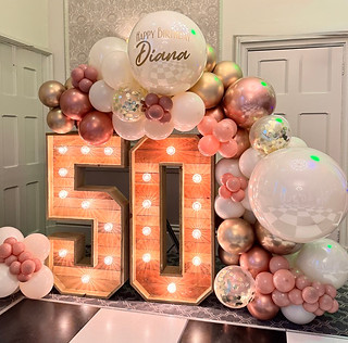 Light up nimbers 50 with balloon garland in cream and pink colours