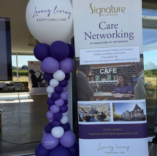 Balloon columns for a corporate event in purple colours