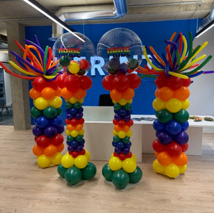Bright rainbow balloon columns to celebrate pride month