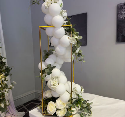 Table balloon centrepieces  in white colour with greenery for weddings and anniversary 