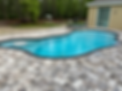 Inground swimming pool with patio and attached spa built by Trinity Pools in Florida