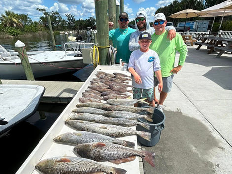 Family proudly displays their impressive catch of fish at Crystalriverfishing