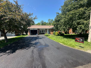 Cracks & Potholes: When to Repair vs. When to Repave Your Driveway