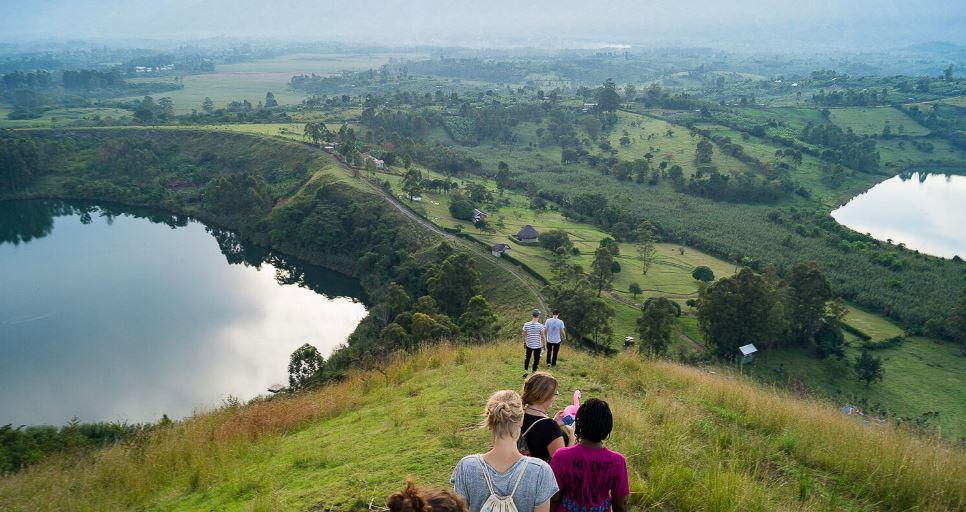 Hikers overlooking crater lakes in Semuliki National Park.
