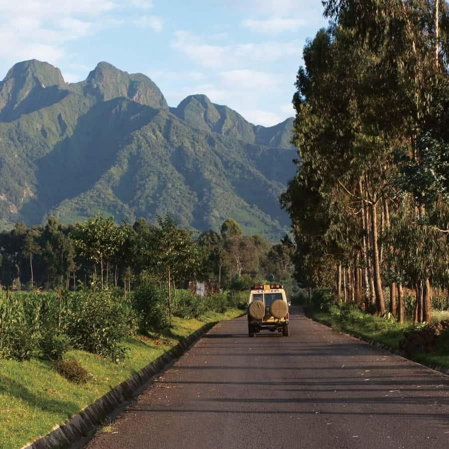 Safari vehicle on a Uganda gorilla tours road near Mgahinga.