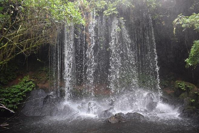 Waterfall at Amabere Caves in Fort Portal, Uganda Tour