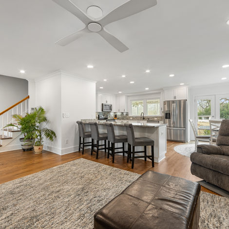 a kitchen with stainless steel appliances and a ceiling fan
