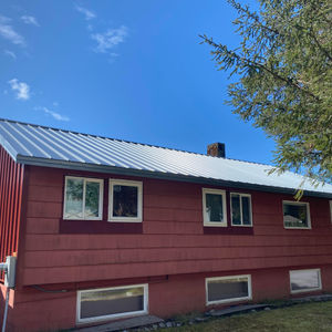 Weathered Zink roof, with Colonial Red Siding accent  