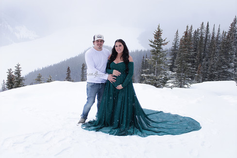 Maternity couple on mountain scene in Banff, Alberta