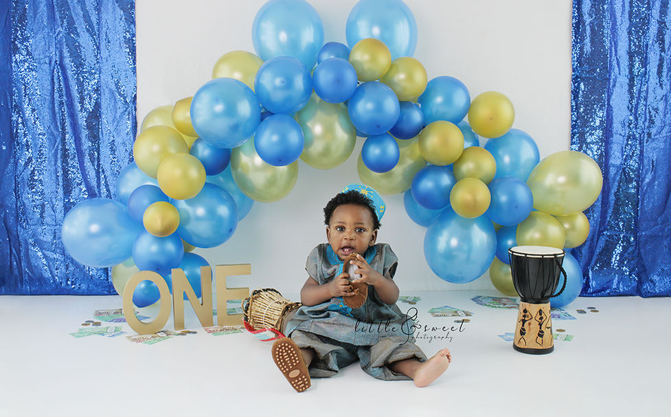 Baby wearing traditional Nigerian outfit for cake smash