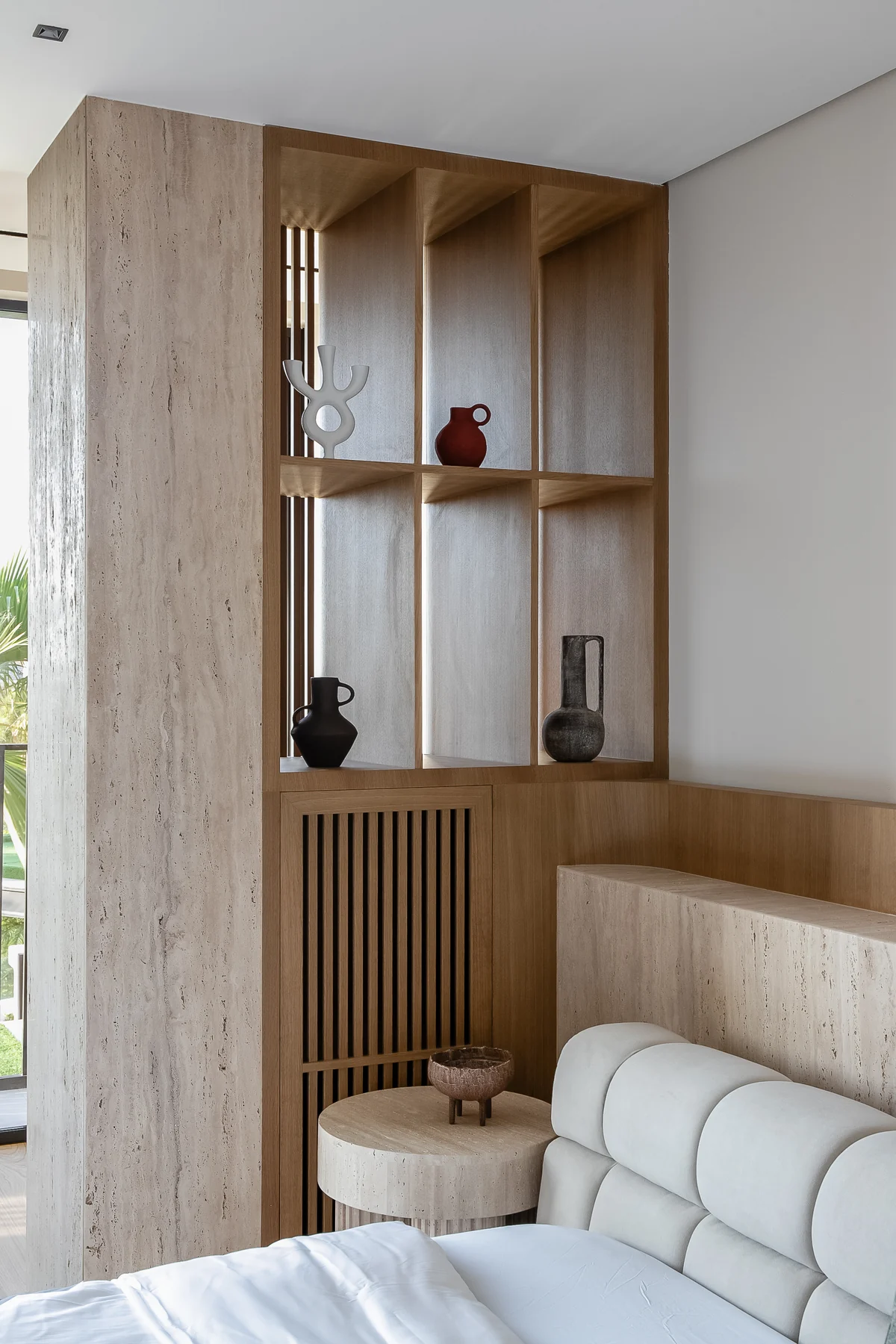 Villa 37 bedroom detail with bespoke timber shelving and upholstered seating