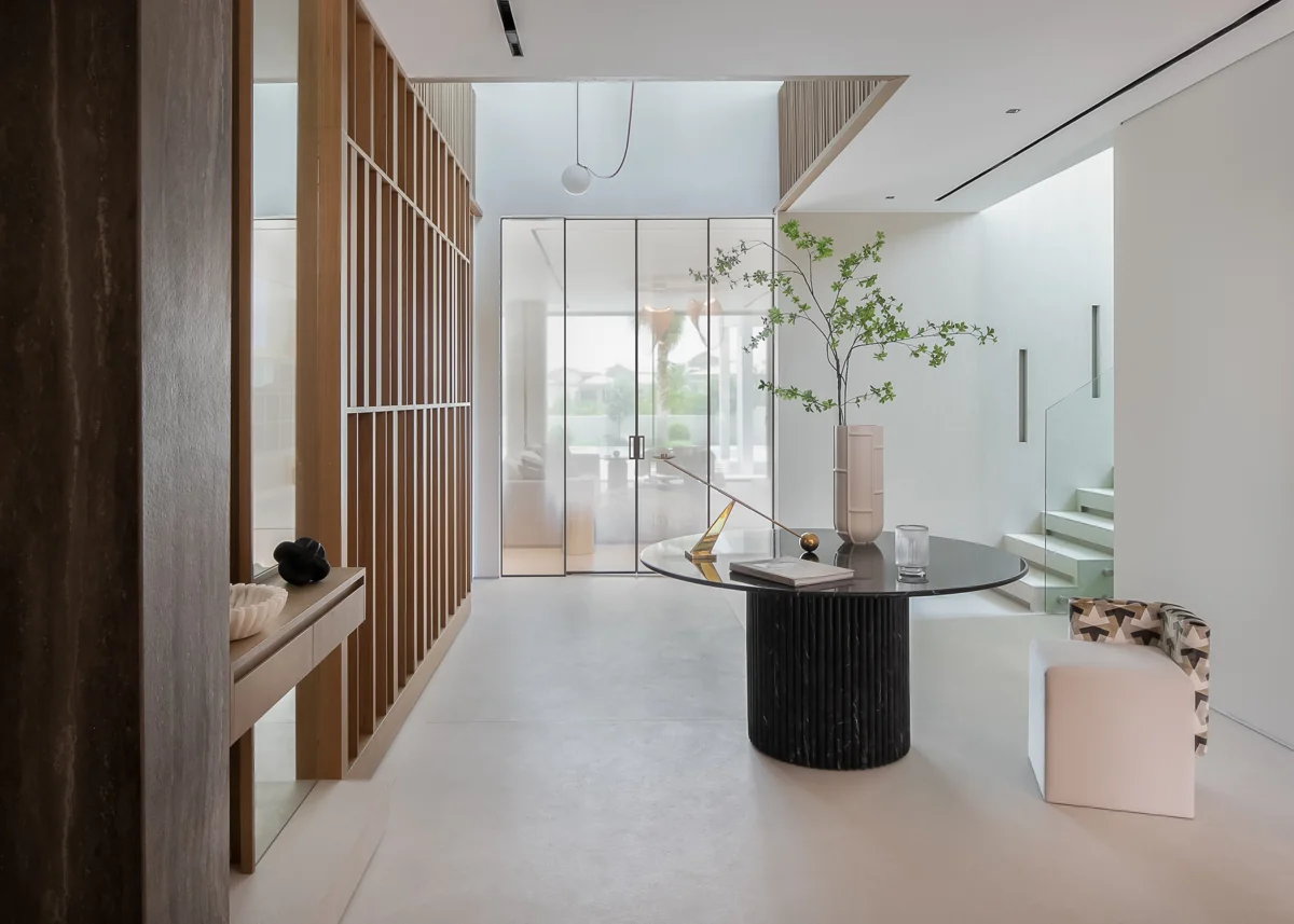 Villa 37 entrance with timber screens, a sculptural table and bespoke interior details