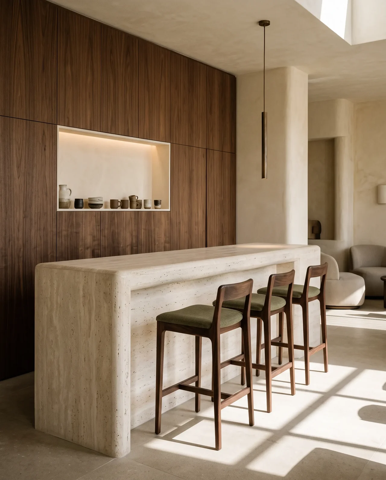Café bar design study with a sculptural travertine counter, walnut stools and olive upholstery