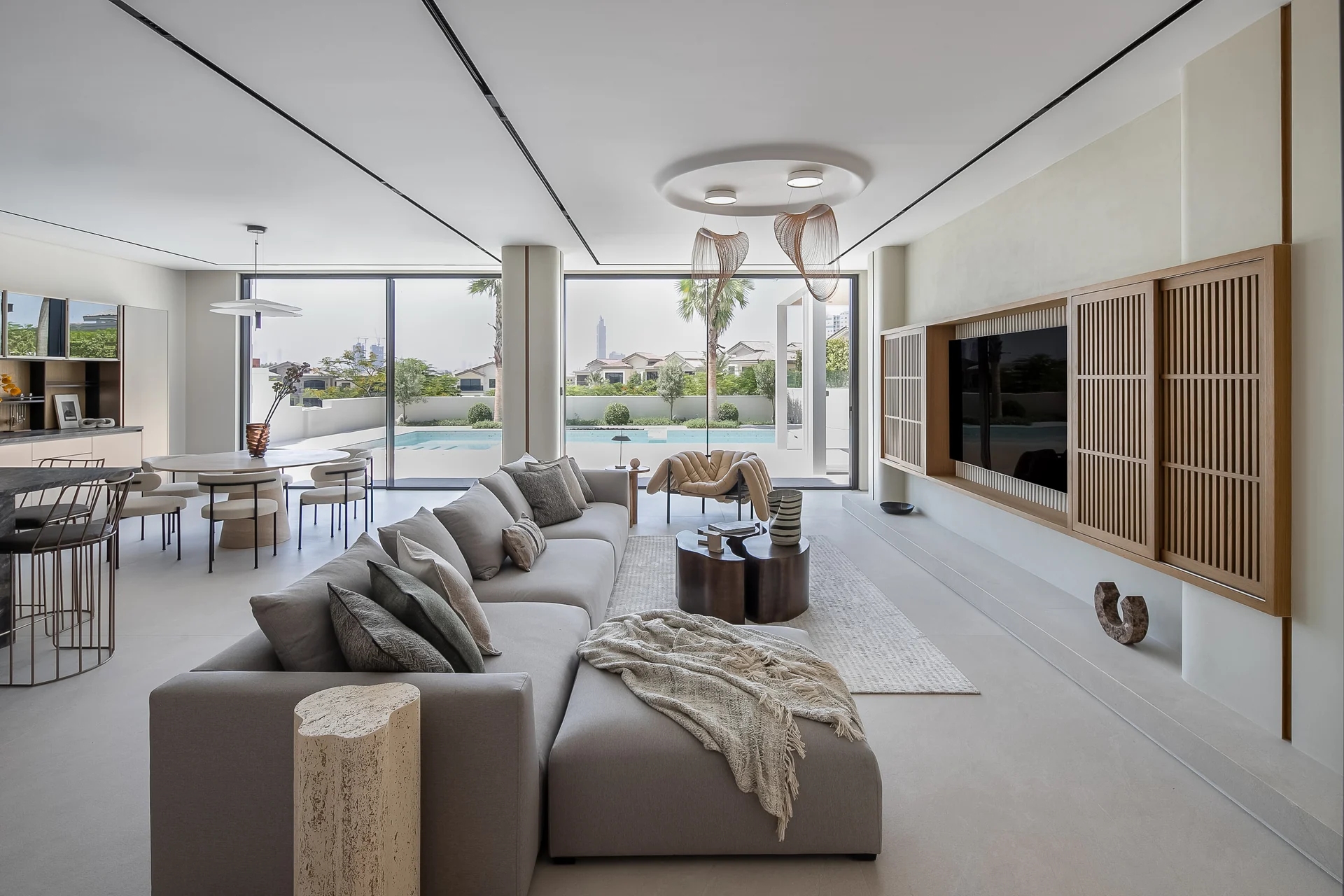 Villa 37 living and dining spaces with bespoke furniture, timber details and garden views