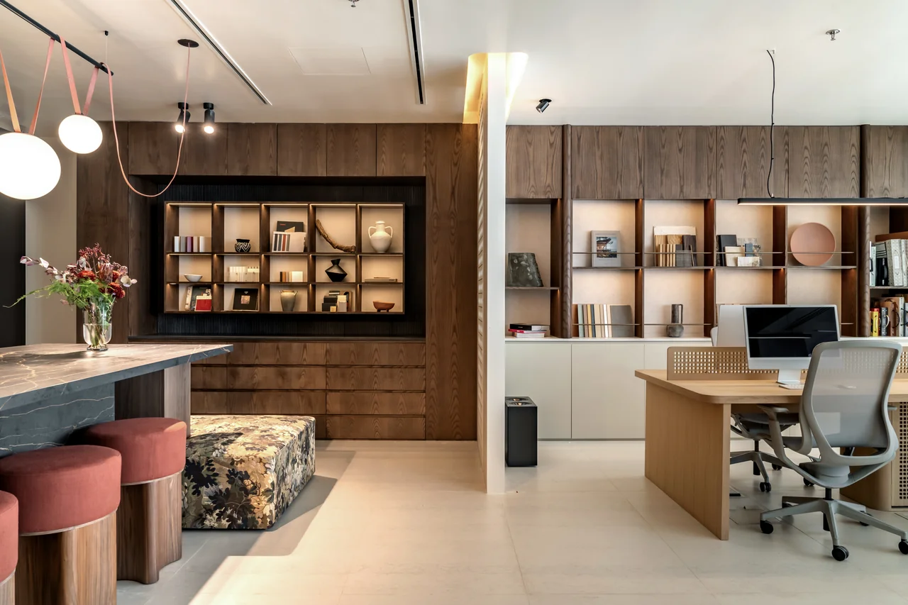 C’est ici Design Studio 2.0 with a shared stone-topped island, wood cabinetry and open workstations.