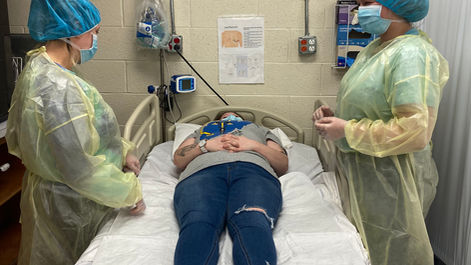 Practical Nursing practicing PPE, bed making and transfers.