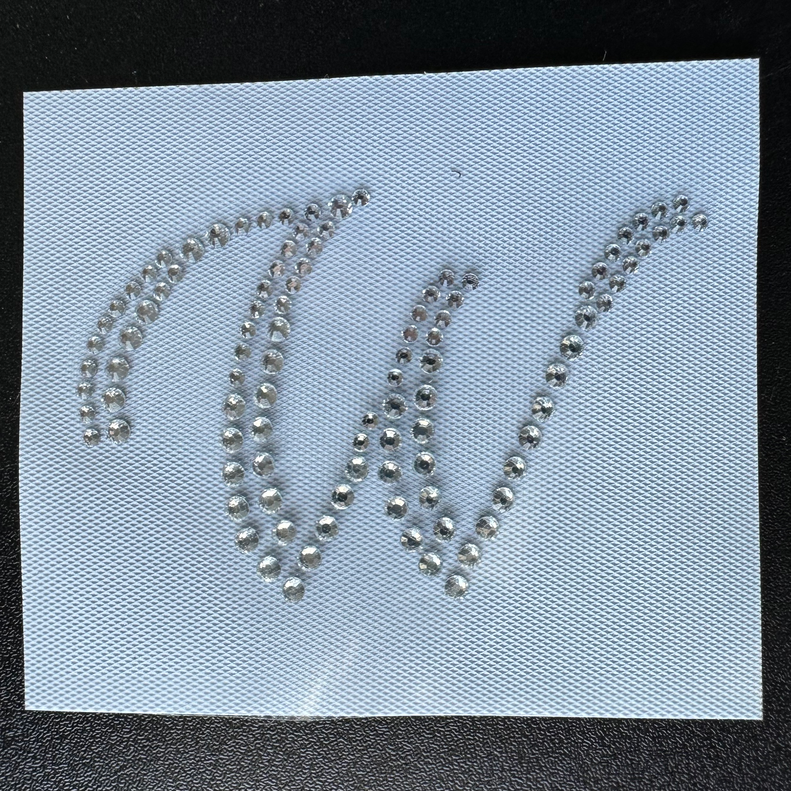 W in Clear Crystal Script