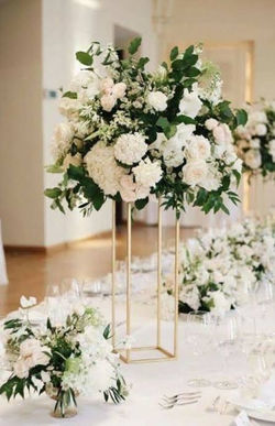 Gold floral stands with foliage