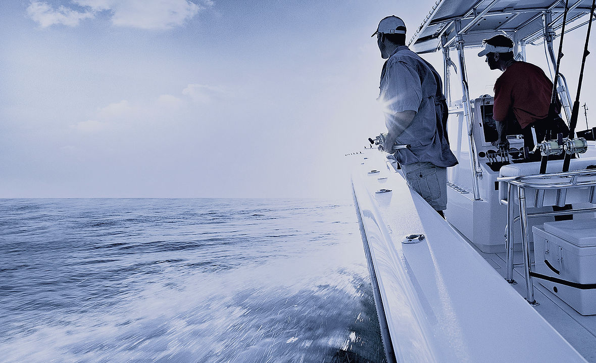 Couple of guys fishing on a boat in the Gulf of America