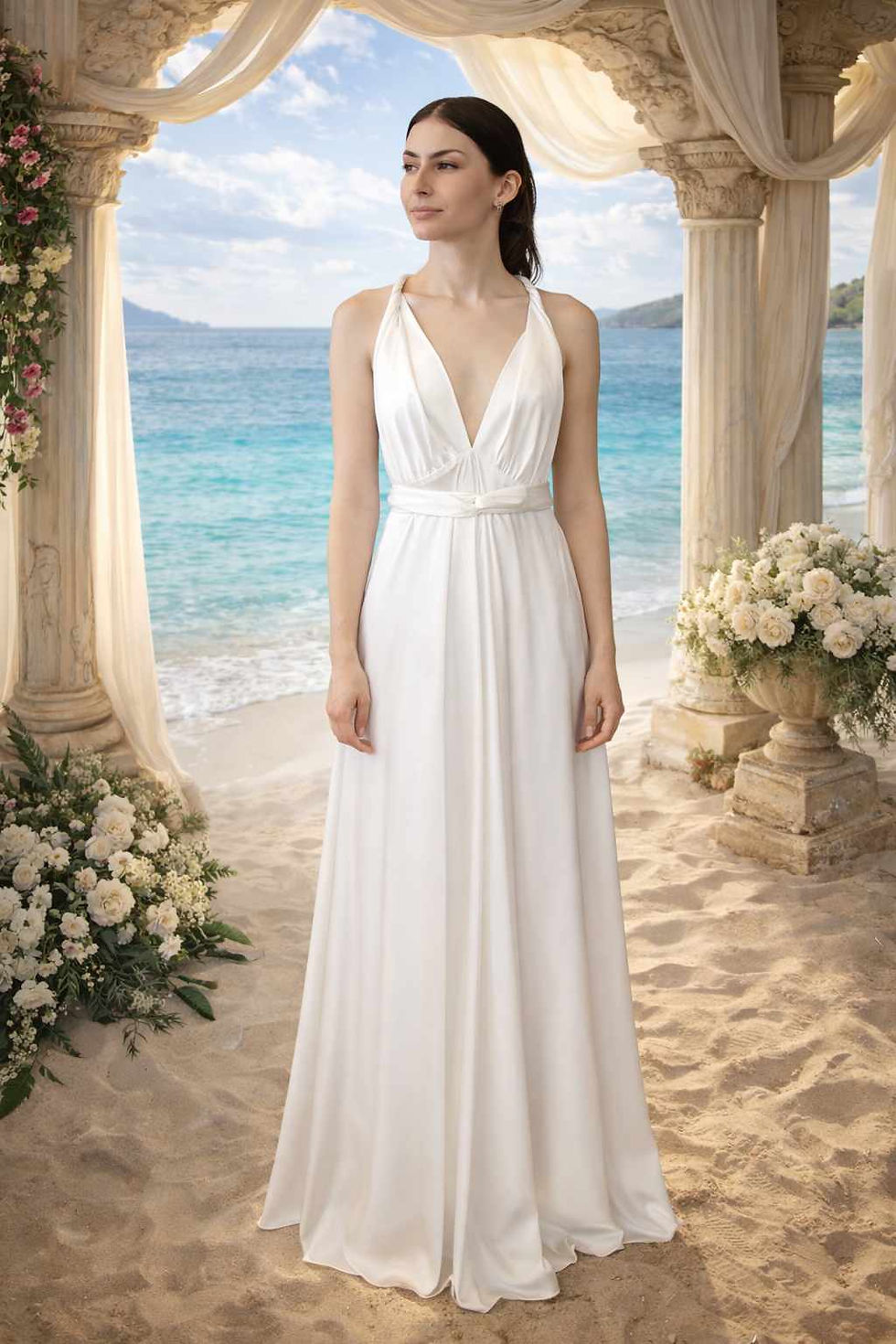 Thumbnail: Woman in white halter dress under floral arch on beach