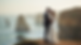 Eye-level view of a couple exchanging vows on a cliff overlooking the ocean
