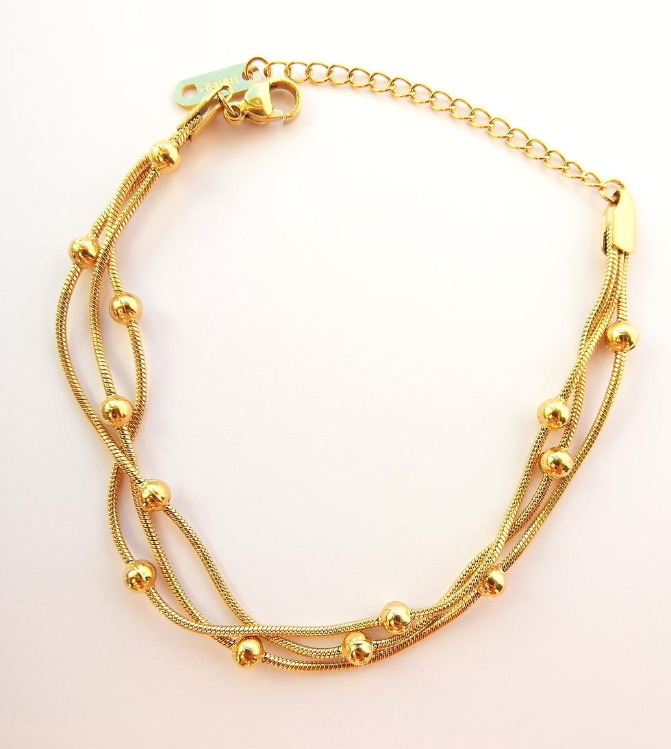 Gold multi-strand bracelet with polished round bead accents and an adjustable chain clasp, photographed on a white background