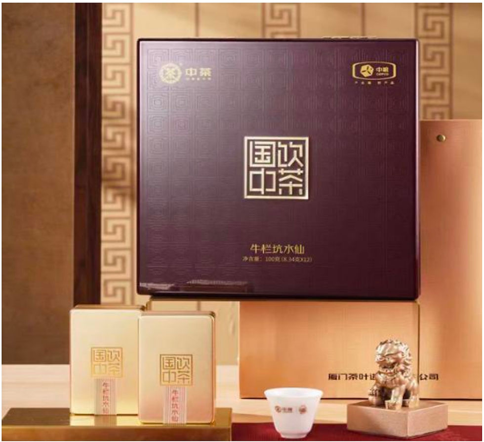 Premium Chinese tea gift set featuring a dark purple presentation box, matching tea tins, and a porcelain teacup displayed in