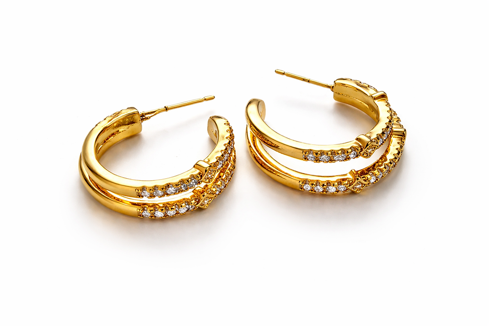 Gold hoop earrings with layered curved bands and pavé-set clear stones, displayed on a white background.