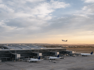 Wide view of Nagpur Airport terminal with aircraft on runway and limited international flight activity