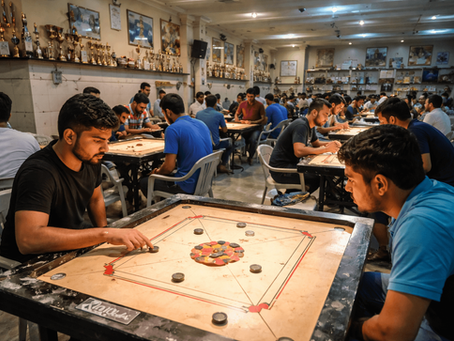 People playing carrom on multiple boards inside a crowded carrom hall in Akola