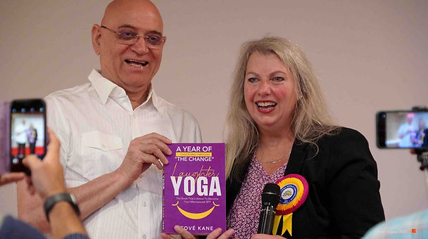 Founder of Laughter Yoga Dr Kataria and Tove Kane with her book and micrrophone phot credi