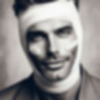 Attractive man with head bandages depicting a makeover to introduce the design of the Apple MacBook Air (M2-2022)