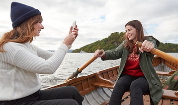 Friends Rowing a Boat