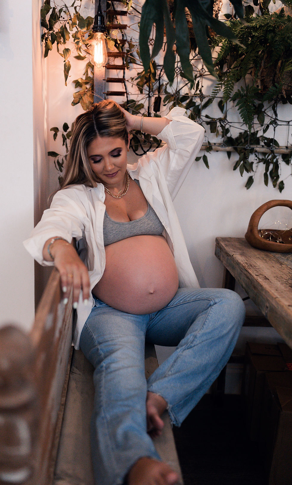 a downtown maternity session in a flowershop. garden scape photoshoot