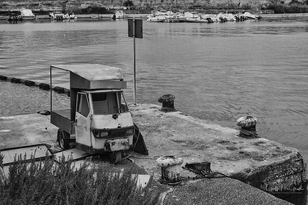 Old disused van, Livorno harbour, Italy.