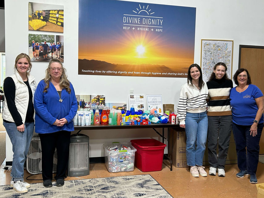 Divine Dignity team with donation boxes