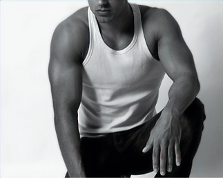 NYC massage therapist in white sleeveless shirt, offering massage, meditation, and tantra sessions DavidTouch