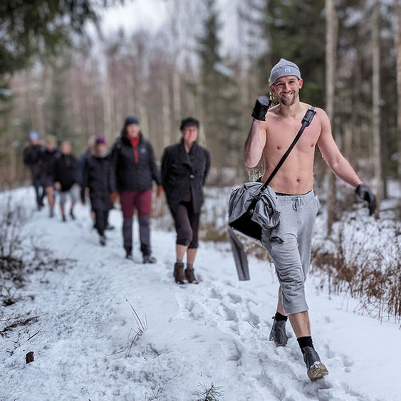 People walking outdoors in snowy nature.
