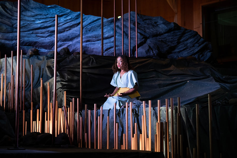 Soloist Natasha Kitavi in the middle of the mountain landscape during the general rehearsal of Chief Hijangua in 2023.