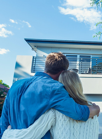 Picture of happy residents looking at their new soft washed home