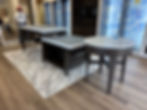 Three modern display tables in a showroom for expert installations
