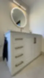 Modern bathroom vanity with illuminated mirror