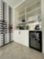 Modern home wine bar with wall racks, beverage cooler