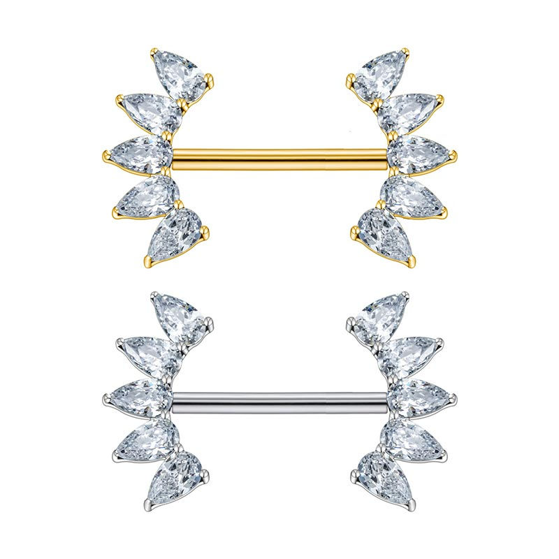 Goldenes und silbernes Nippel Piercing aus Titan mit Edelsteinen besetzt.