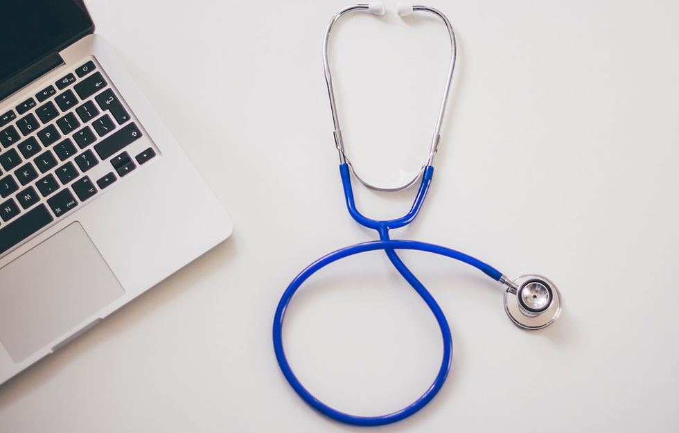 Medical insurance in China for international patients: stethoscope and laptop on a clean desk