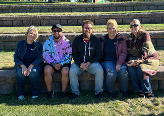 staff hanging out at the supported individual picnic